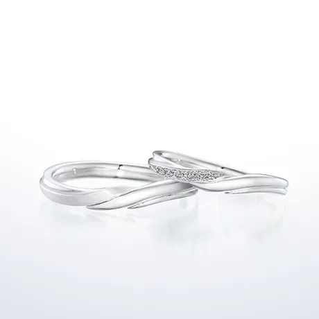 Elegant silver wedding bands with stylized design.