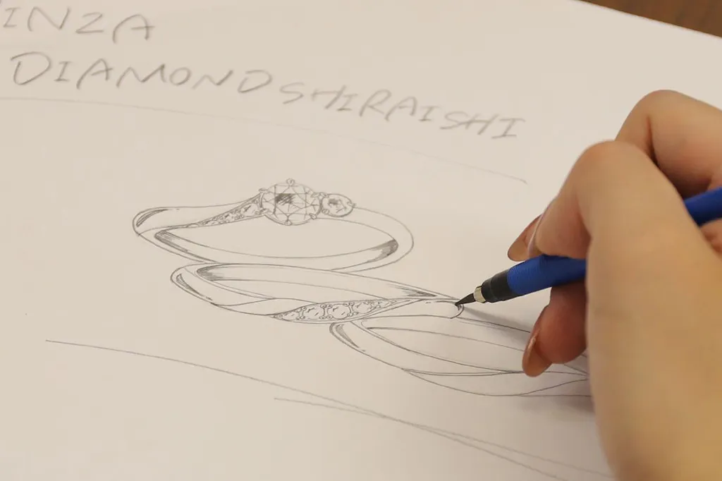 Hand sketching a diamond ring design