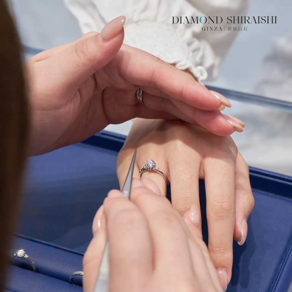 Jewelry expert inspecting a diamond ring.