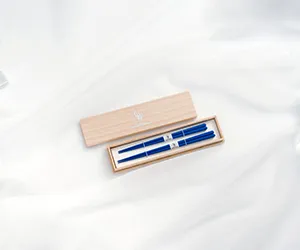 Elegant blue pens in a wooden box.
