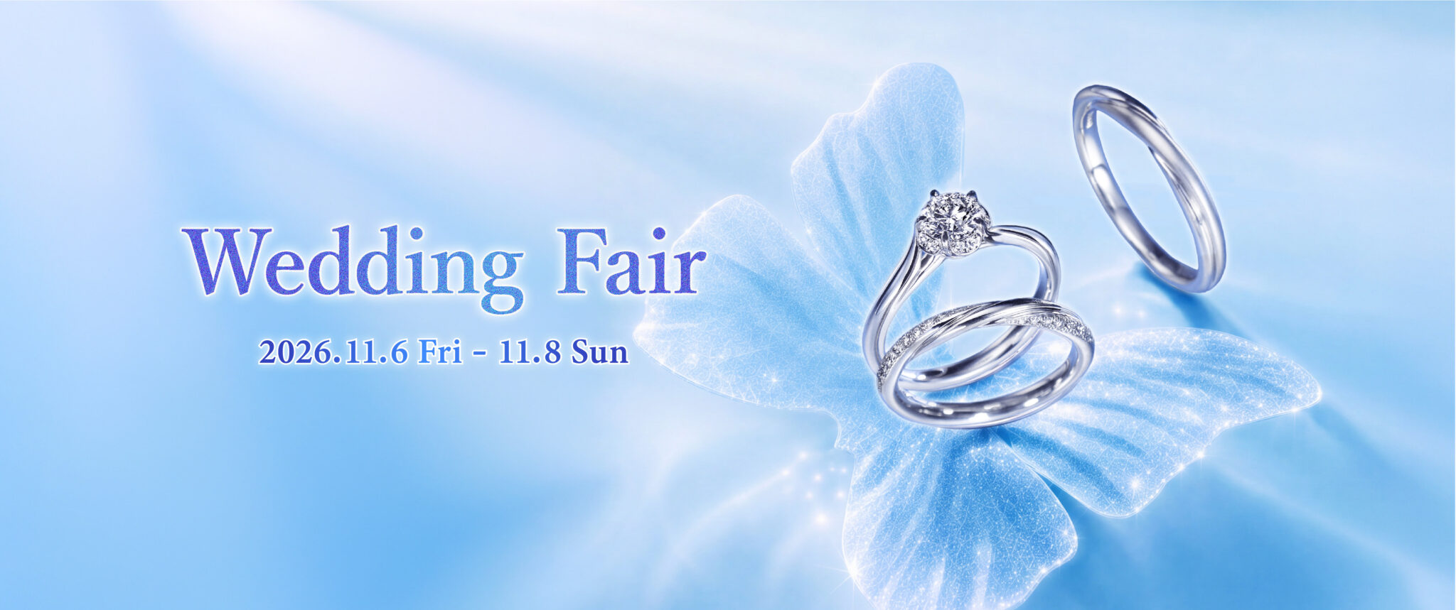 銀座白石婚展橫幅，藍色背景上展示訂婚戒指與結婚對戒；文字標示 Wedding Fair 及 2026 年 11 月 6 日至 8 日